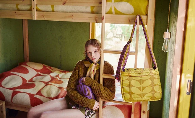 Orla Kiely puffy bags hanging from a bunk bed