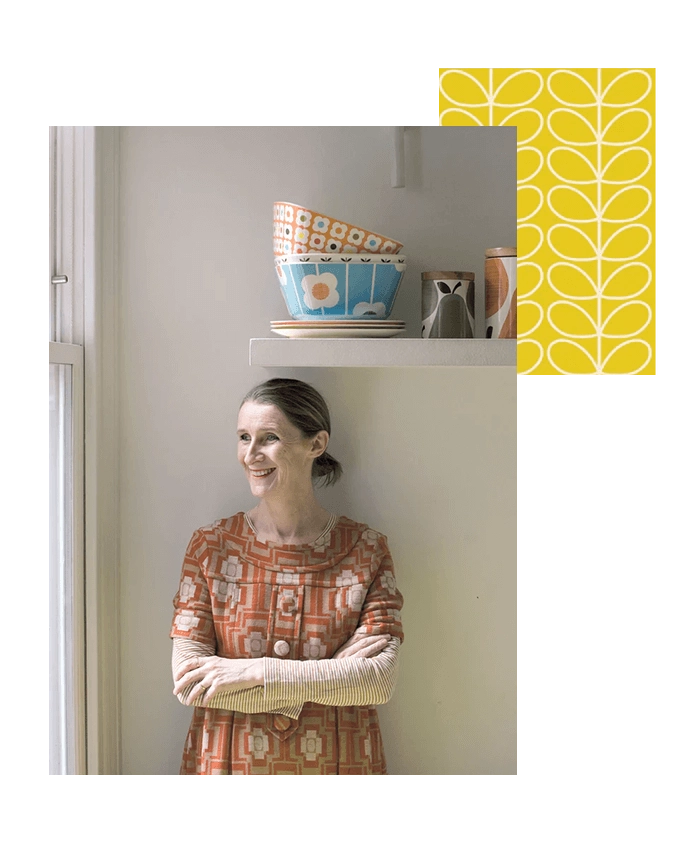 Orla Kiely standing under a shelf with her arms crossed